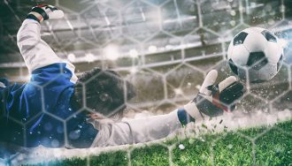 An image of a goalkeeper saving a ball