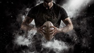 Person holding a rugby ball