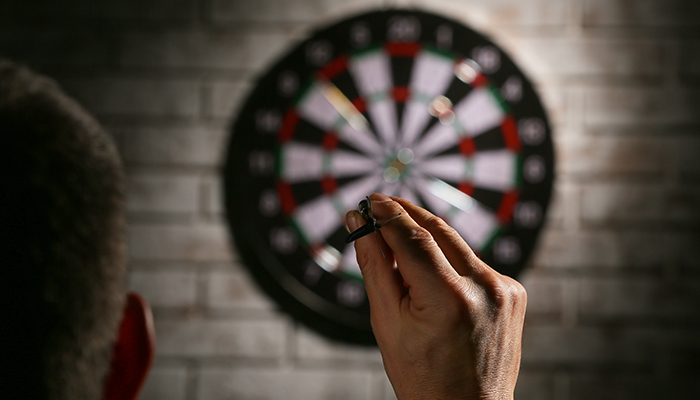 Person Playing Darts