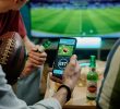 Betting on sports, smart phone with working online betting mobile application