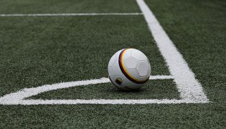 A football in a stadium corner