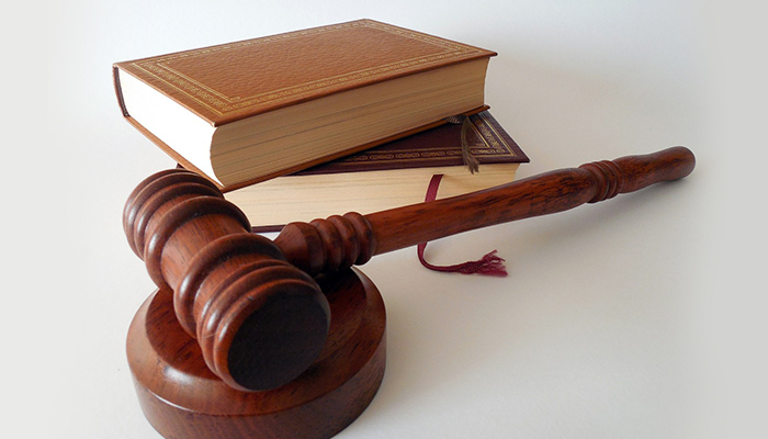 A gavel next to books