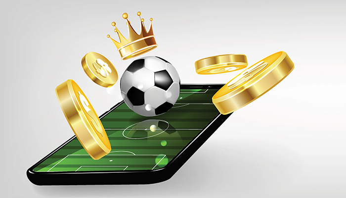 A mobile phone displaying a soccer ball topped with a gold crown and dollar signs.